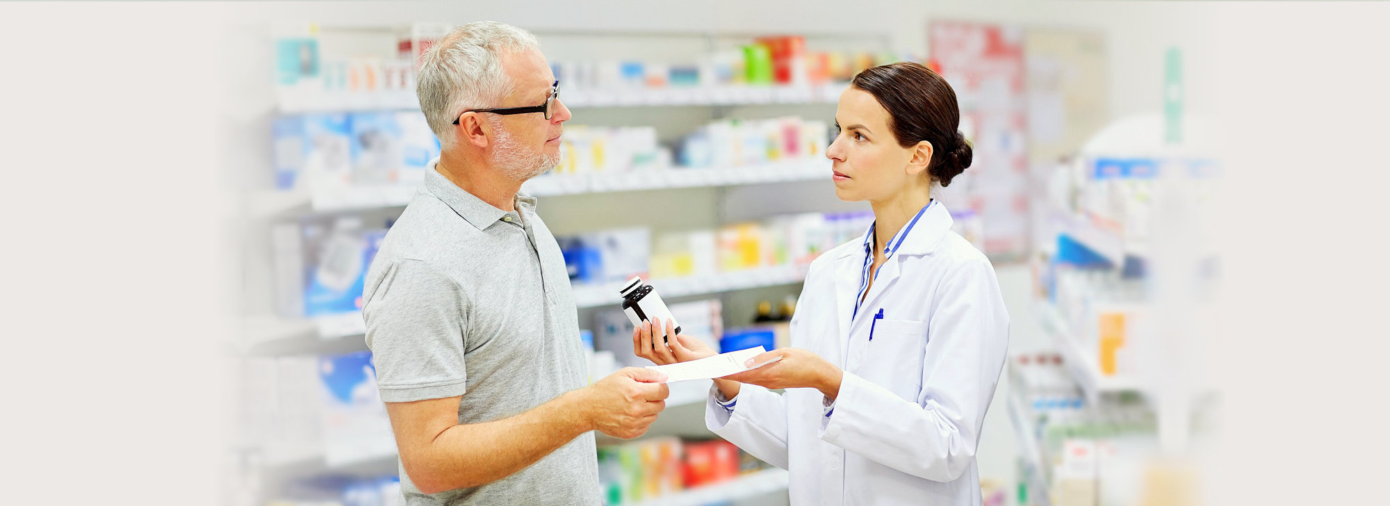 pharmacist and customer looking each other